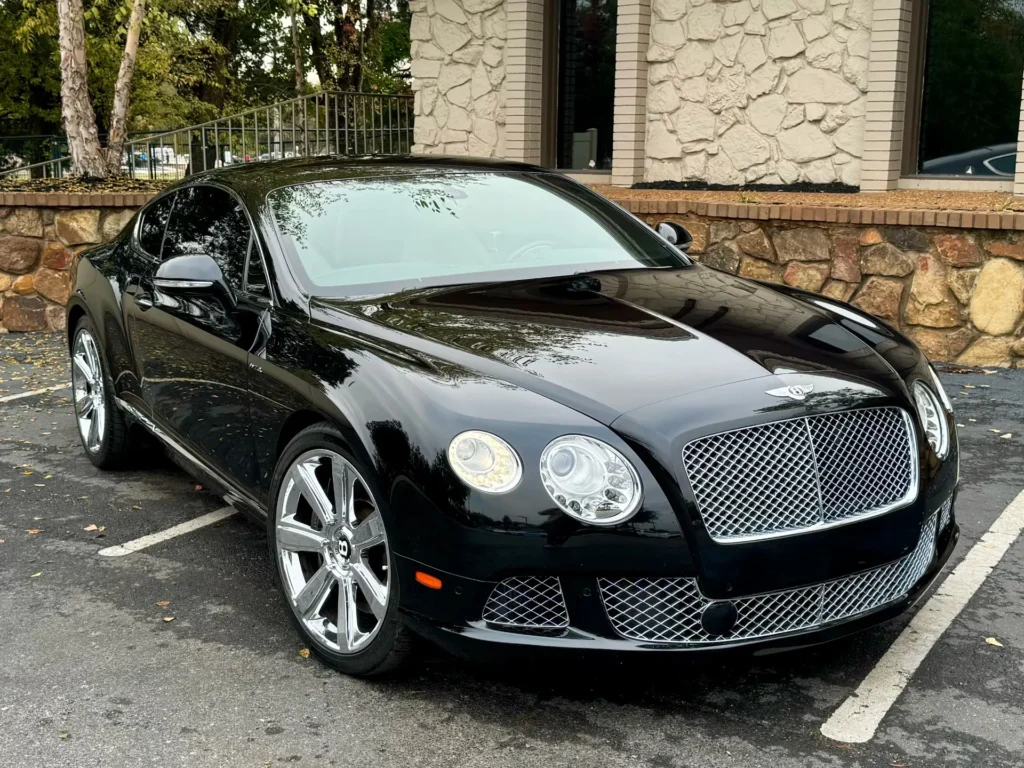 Black 2012 Bentley Continental GT with a sleek design, parked at AutoPro Nashville, showcasing its luxurious and timeless appeal.