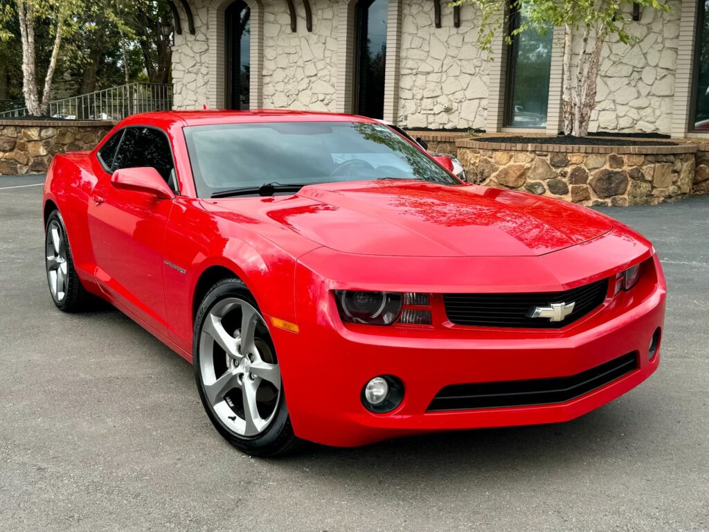 Front view of a red 2013 Chevrolet Camaro LT coupe.