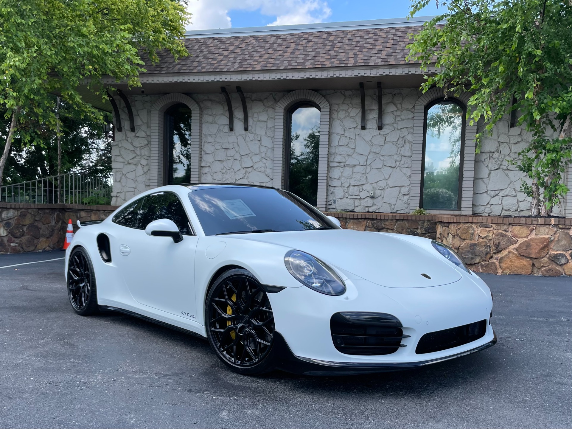 Front view of a used 2015 Porsche 911 Turbo Premium Plus with AeroKit at AutoPro Nashville.