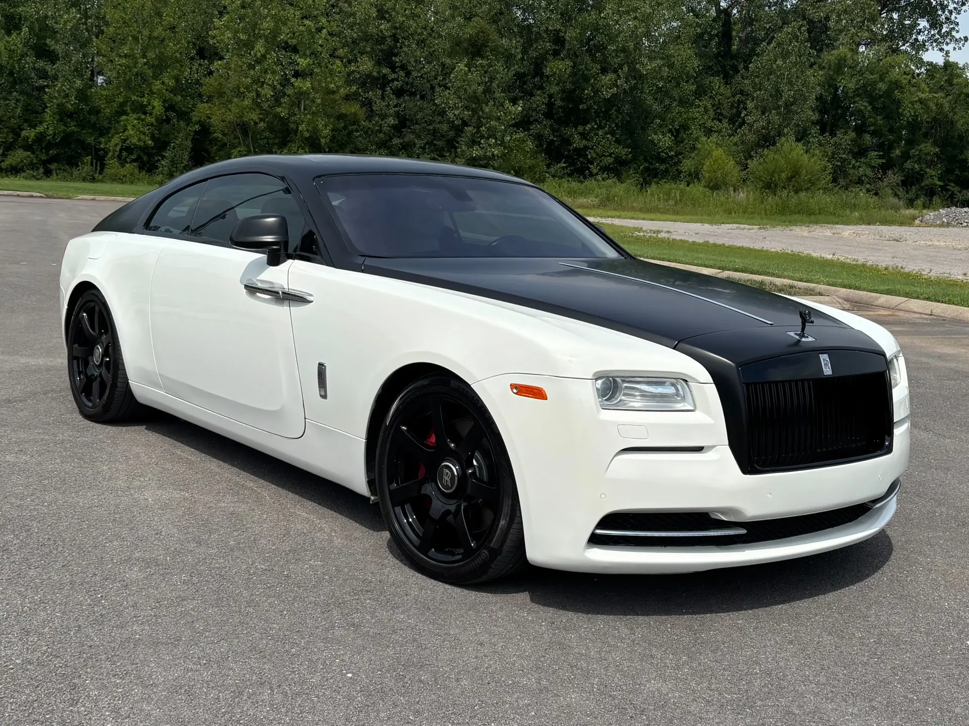Two-tone white and black 2016 Rolls-Royce Wraith luxury coupe.