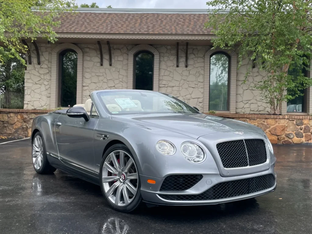 Silver 2017 Bentley Continental GT Convertible parked at AutoPro Nashville, showing off its elegant design with sleek curves and luxury features.