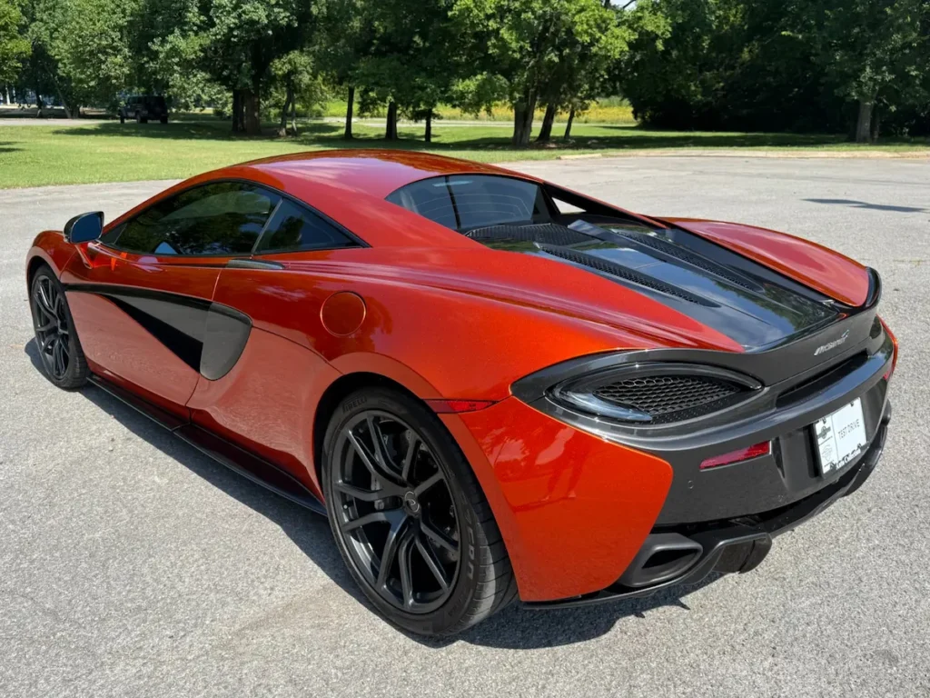 Rear angle of a 2017 McLaren 570S showing carbon-fiber details and aerodynamic body lines.