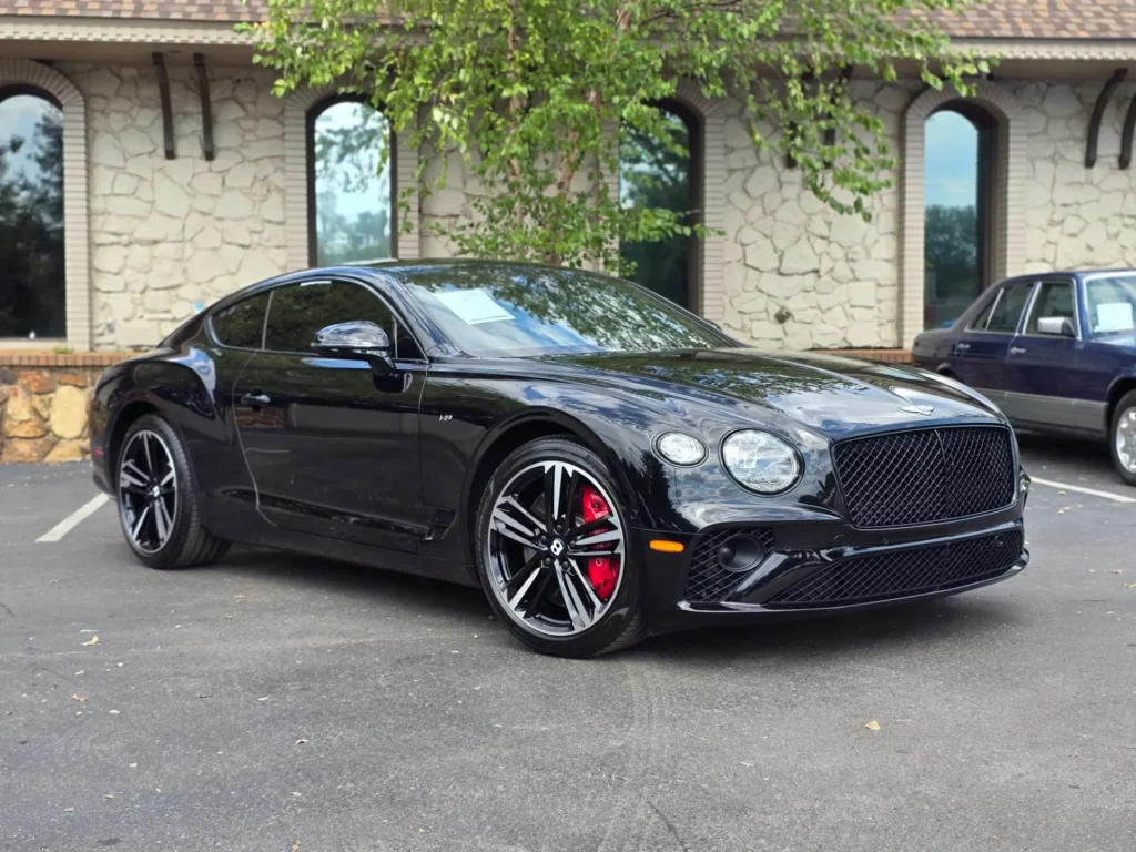 Black 2020 Bentley Continental GT Coupe with red brake calipers, parked at AutoPro Nashville, showcasing its sporty and luxurious design.