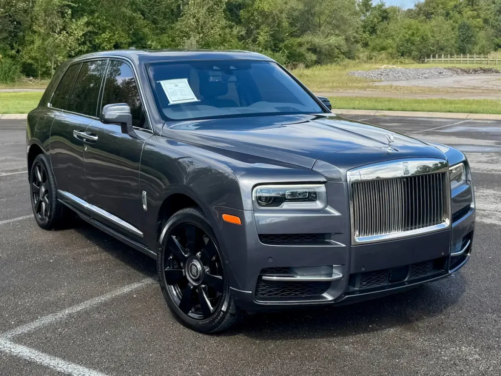 Front view of 2020 Rolls-Royce Cullinan SUV in metallic gray with chrome grille.