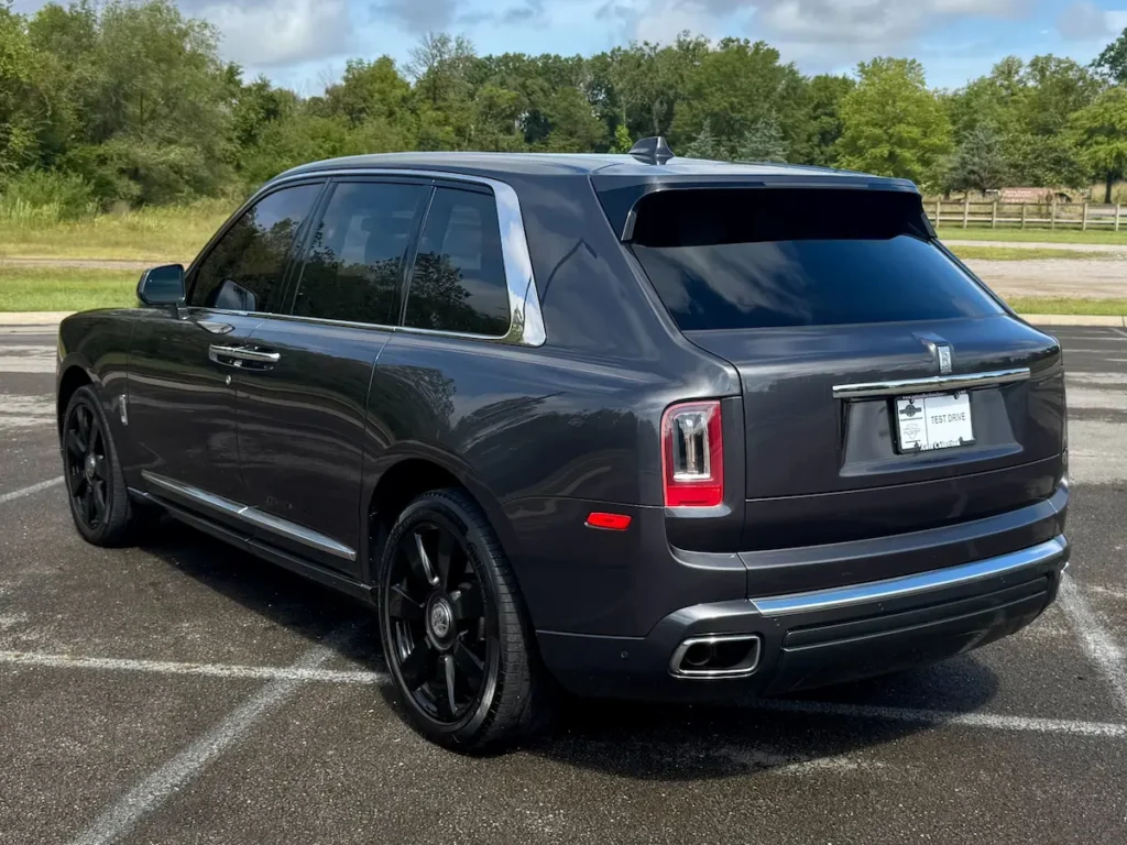 Rear angle of 2020 Rolls-Royce Cullinan highlighting LED taillights and chrome accents.