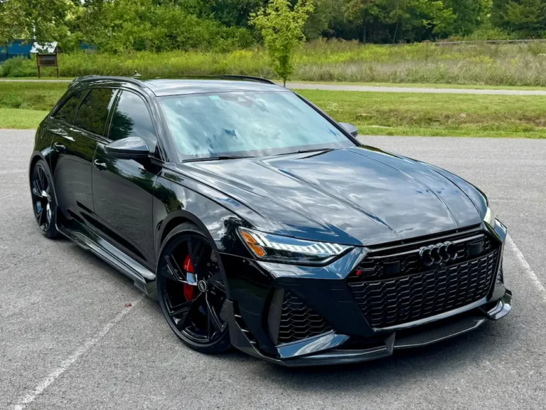 2023 Audi RS6 Avant performance wagon in dark gray, sporty design with black wheels.