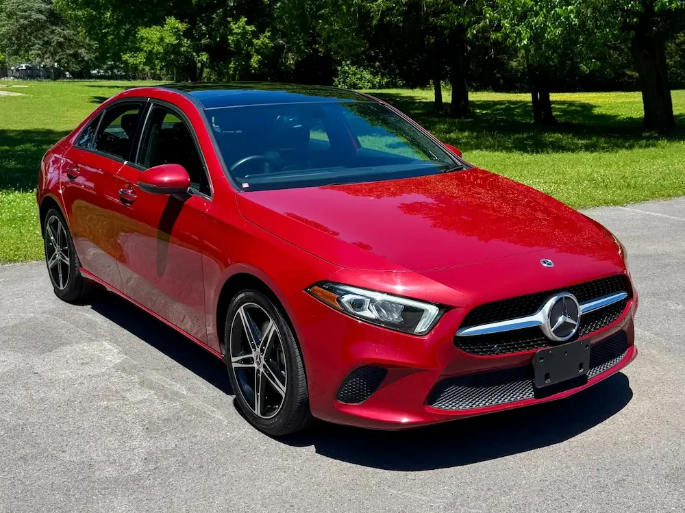 2021 Mercedes-Benz A 220 4MATIC in red showcasing compact luxury sedan design.