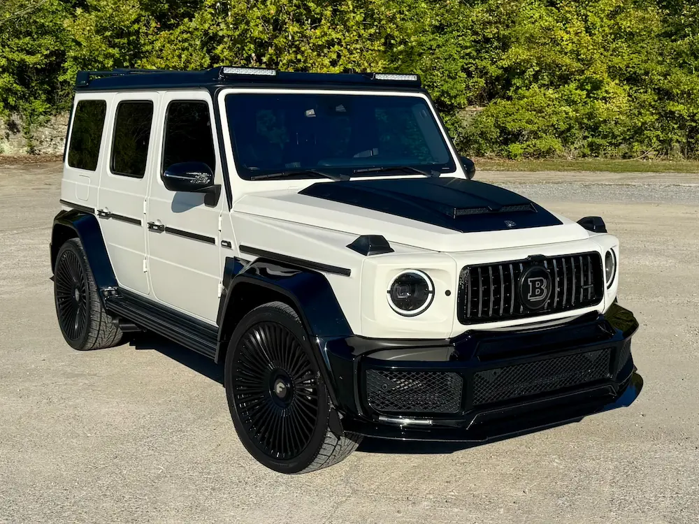 2021 Mercedes-Benz G 550 Brabus edition in white and black with custom body kit and luxury SUV styling.