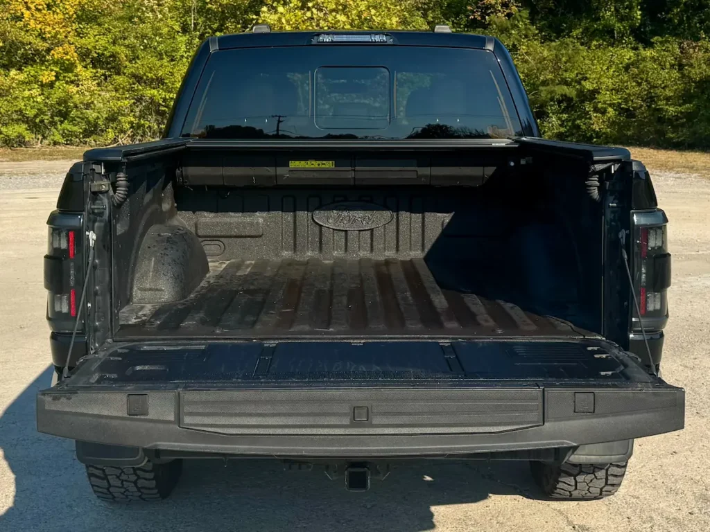 Open bed of a Ford F-150 King Ranch with durable spray-in liner and fold-down tailgate.