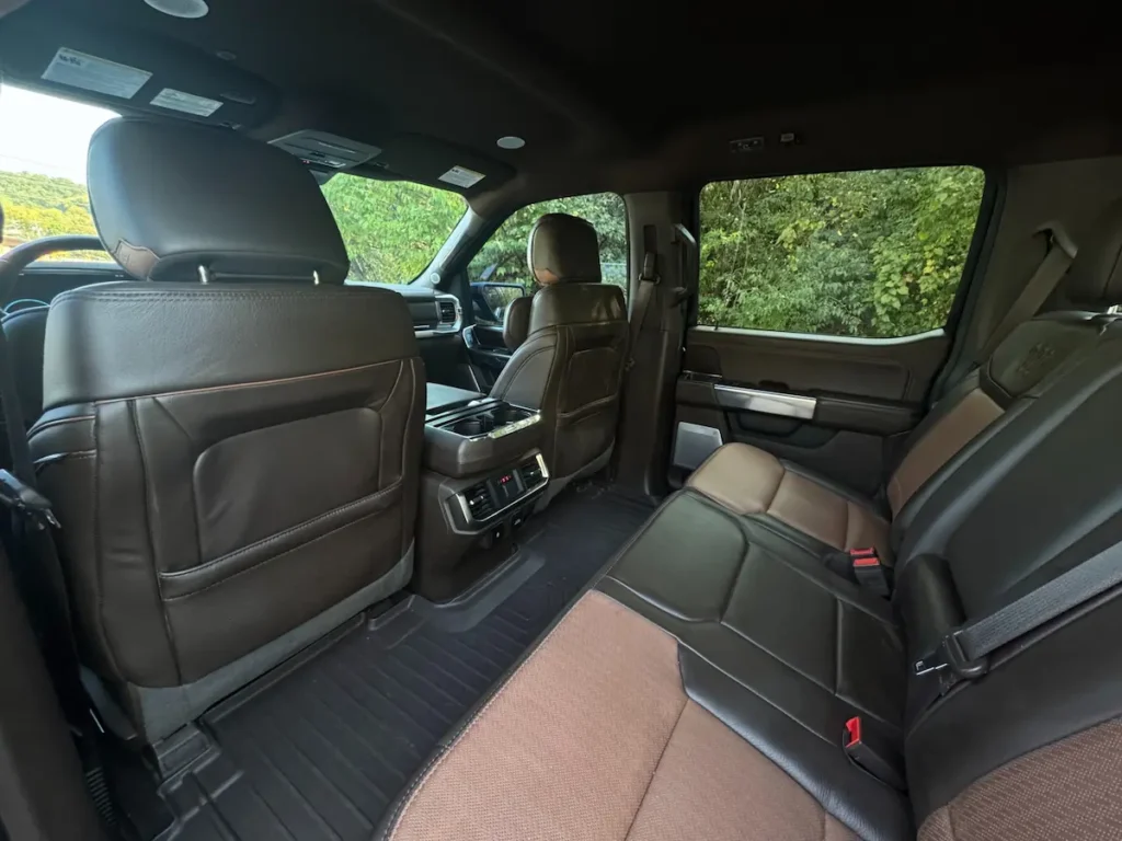 Rear seating area of a Ford F-150 King Ranch featuring two-tone leather upholstery and premium finishes.