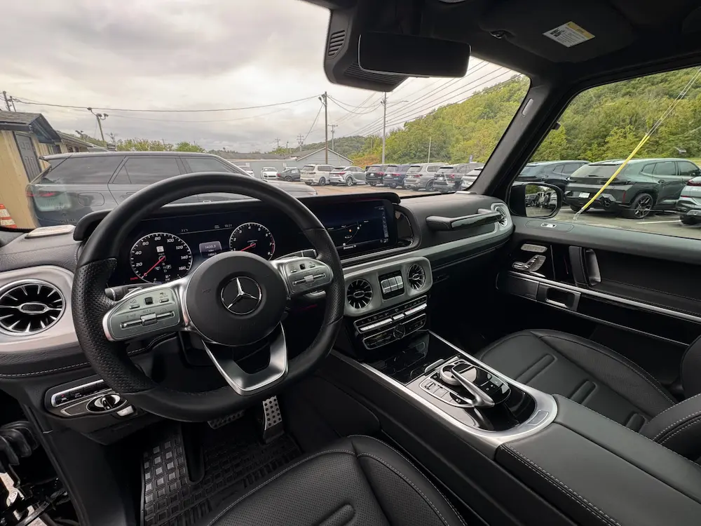 Interior of 2022 Mercedes-Benz G 550 showing digital cockpit, Nappa leather seats, and modern infotainment system.