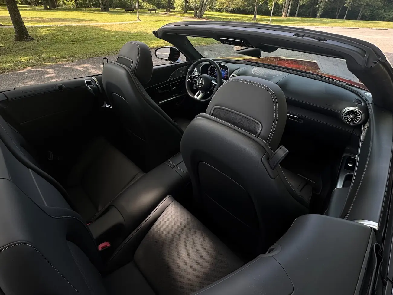 Rear seating area of the 2022 Mercedes-AMG SL63 Roadster with black leather trim.