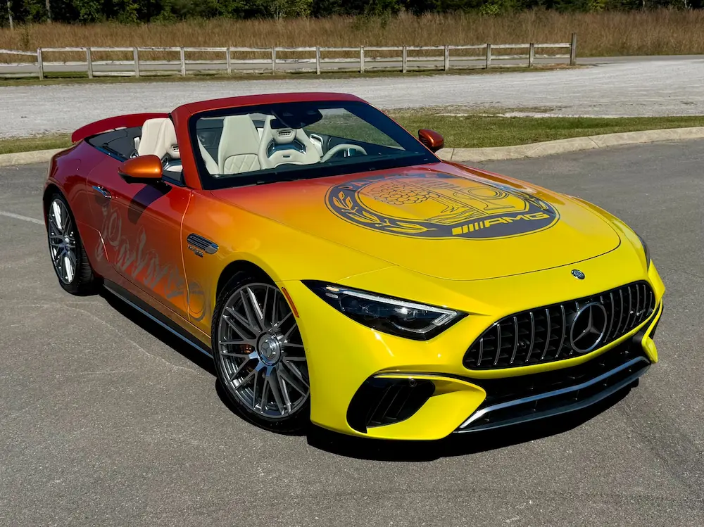 2022 Mercedes-Benz SL 63 AMG Palace Edition in exclusive yellow-to-orange gradient wrap featuring AMG hood graphics and carbon ceramic brakes.