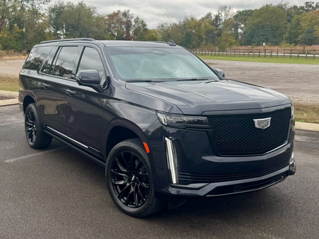 2023 Cadillac Escalade ESV Sport Platinum front three-quarter view featuring Onyx Package black grille and wheels.