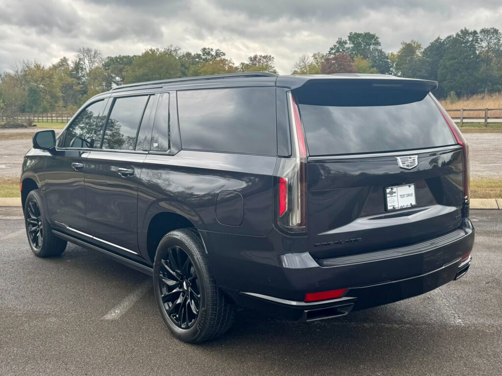 2023 Cadillac Escalade ESV Sport Platinum rear view showcasing LED taillights and gloss-black trim.