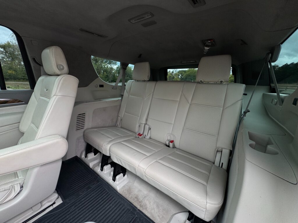 2023 Cadillac Escalade ESV Sport Platinum third-row seating with white perforated leather upholstery.