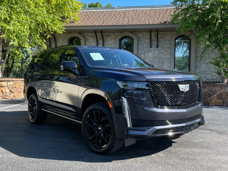 2023 Used Cadillac Escalade SPORT PLATINUM 4WD in black with ONYX package, parked outdoors.