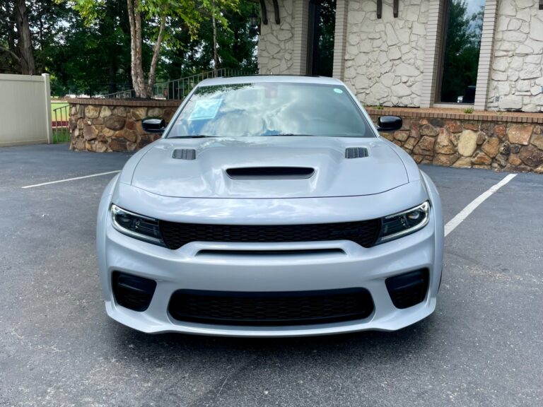Front view of a 2023 Dodge Charger SRT Hellcat Jailbreak Widebody in silver at AutoPro Nashville.