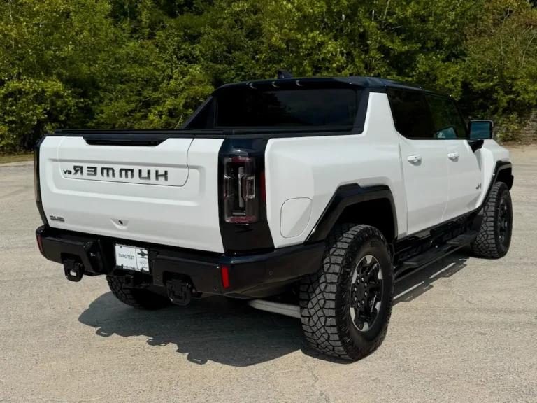 Rear angle of a 2023 GMC Hummer EV 3X Edition 1 pickup truck with Extreme Off-Road Package in white.