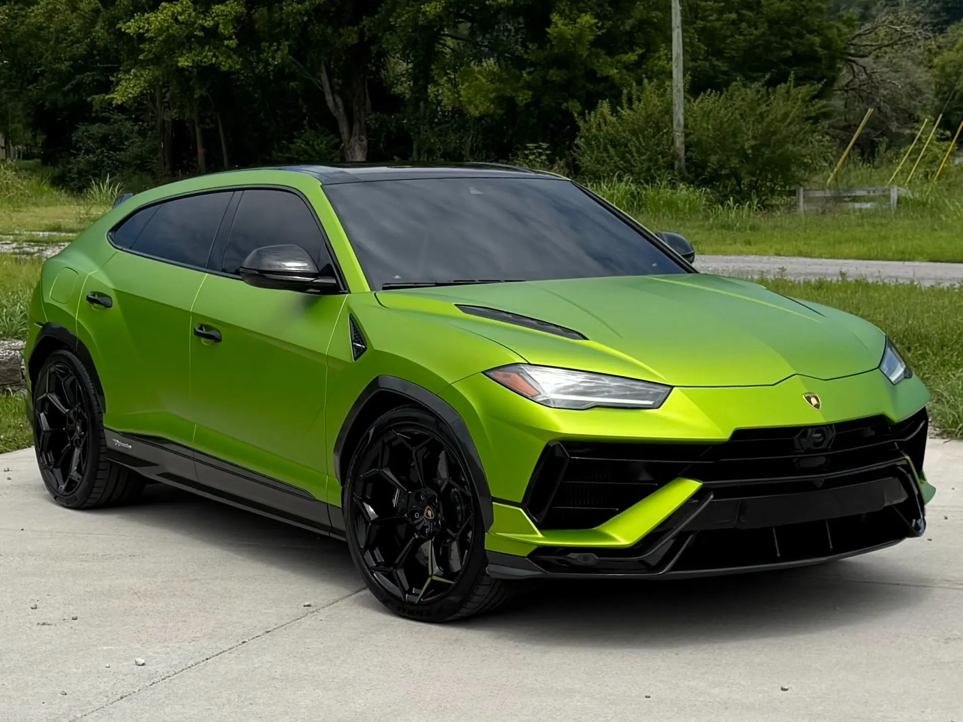 Green 2023 Lamborghini Urus Performante shown from the front three-quarter angle.