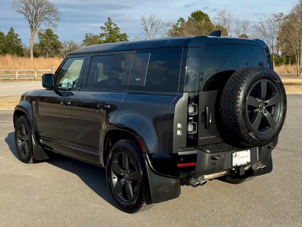 Rear view of a 2023 Land Rover Defender 110 V8 showing spare tire and tailgate design.
