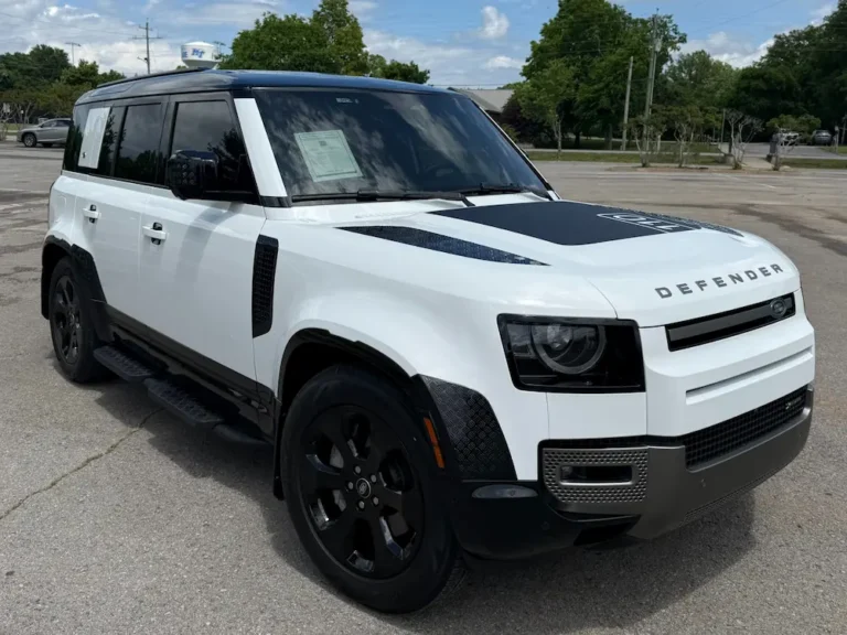 White Land Rover Defender 110 SUV front view with black trim and LED headlights