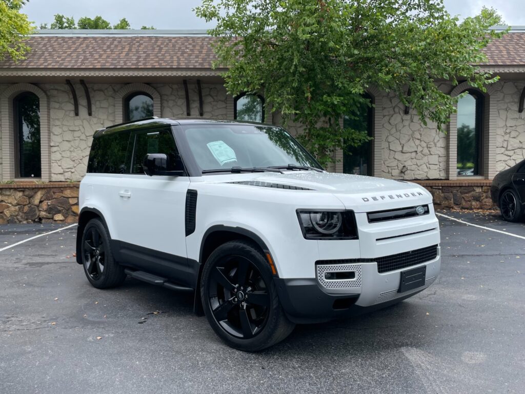 Front view of a white 2023 Land Rover Defender 90 S with Opening Panoramic Sunroof and Air Suspension Pack at AutoPro Nashville.