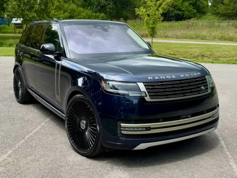 Used Range Rover SUV front angle in navy blue with black custom wheels