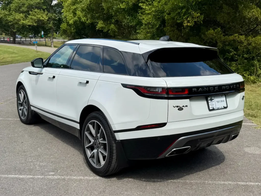 Rear angle of a 2023 Range Rover Velar P340 R-Dynamic S in white.