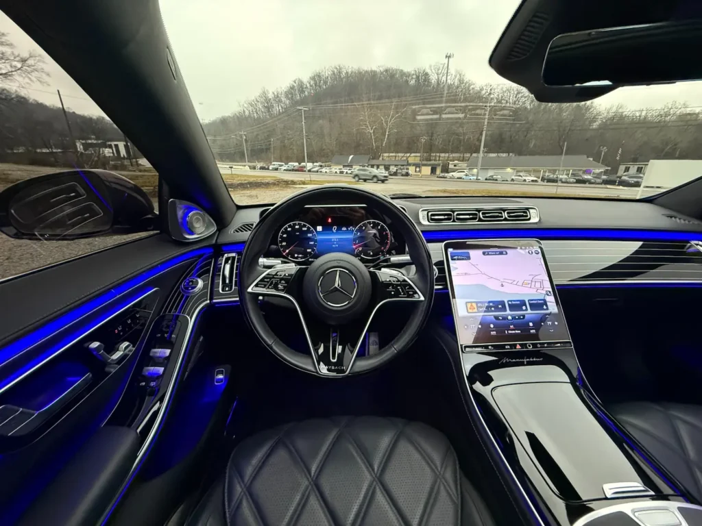 2023 Mercedes-Maybach S680 luxury sedan interior featuring premium leather seats and dual digital displays.