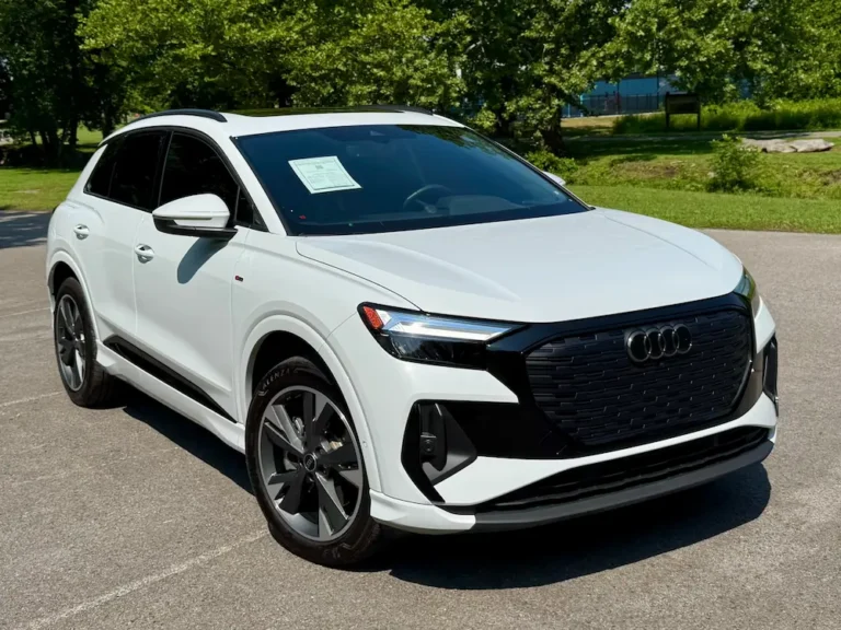 2024 Audi Q4 e-tron Premium Plus SUV in white, electric vehicle with modern styling.
