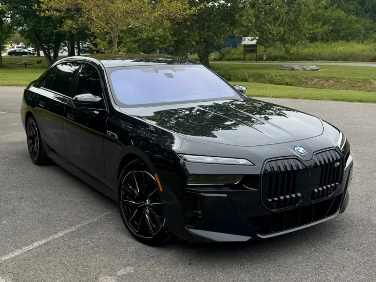 black BMW i7 M70 electric luxury sedan with sleek design parked on pavement