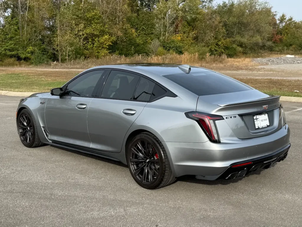 2024 Cadillac CT5-V Blackwing rear exterior highlighting quad exhaust tips, spoiler, and LED taillights.
