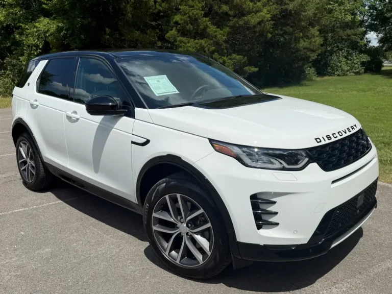 Used Land Rover Discovery Sport white SUV with black roof and LED headlights