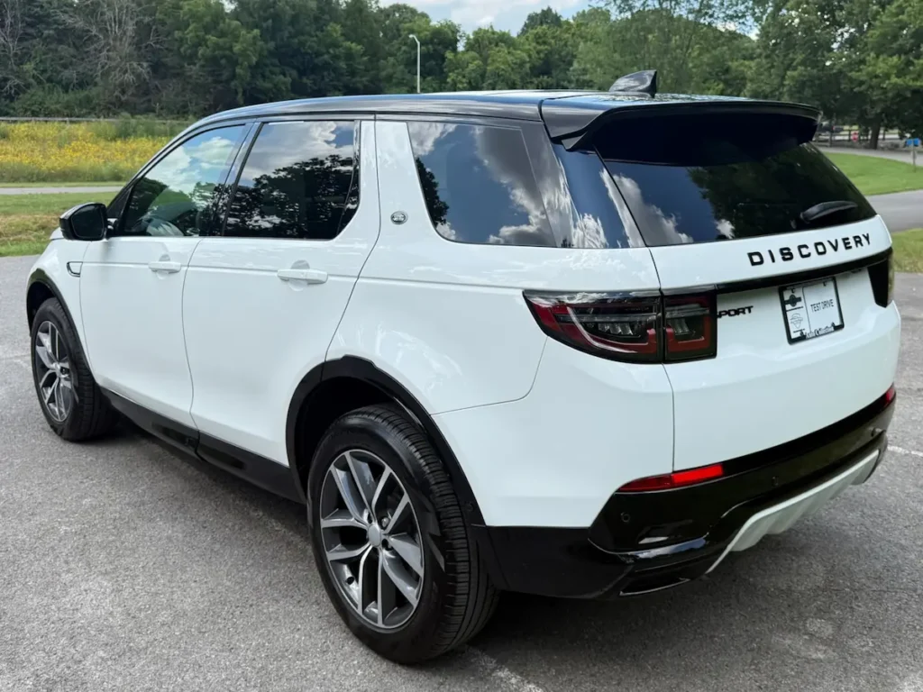 Rear view of 2024 Land Rover Discovery Sport P250 SE in white and black.