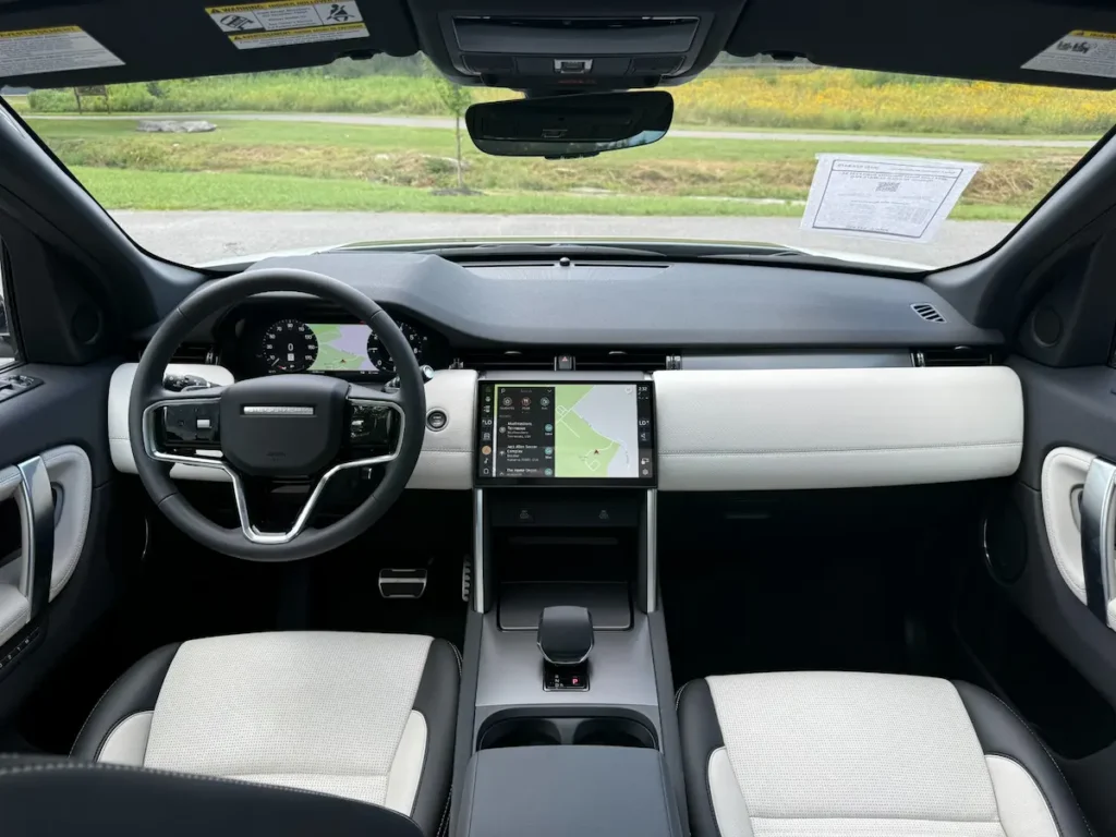 Interior cockpit of 2024 Land Rover Discovery Sport P250 SE with digital displays.
