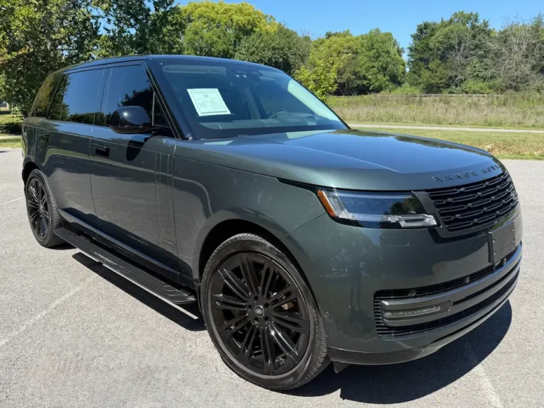 Used Range Rover SUV front angle with black wheels and metallic gray finish