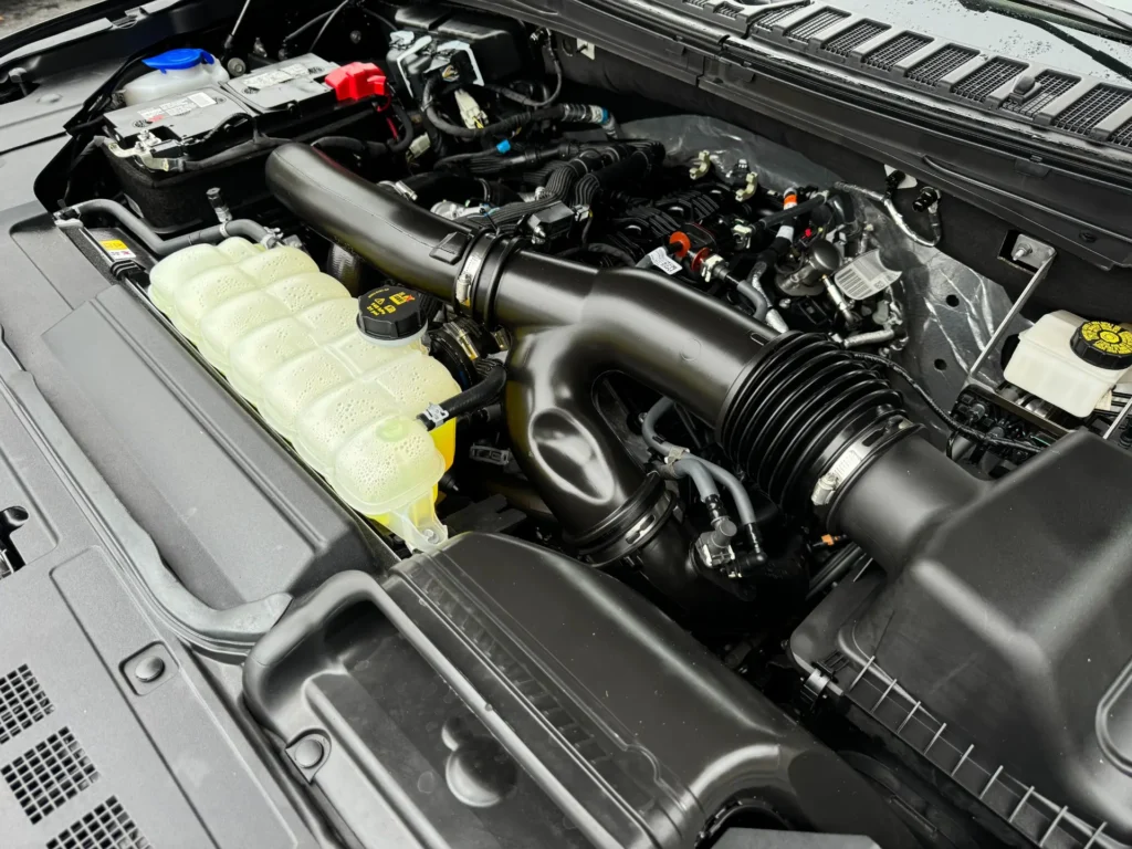 Engine bay of the 2024 Lincoln Navigator Reserve, displaying a clean and powerful turbocharged V6 engine.
