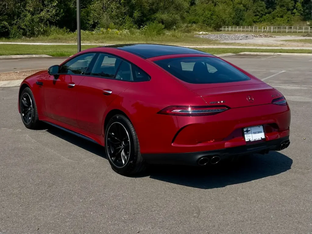 Red Mercedes-AMG GT 43 rear exterior with AMG styling