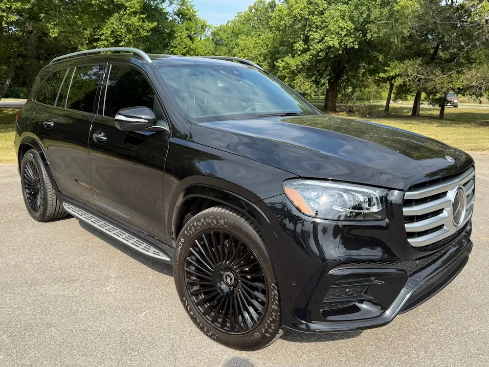 2024 Mercedes-Benz GLS 450 4MATIC in black featuring AMG Line exterior and multi-spoke wheels.