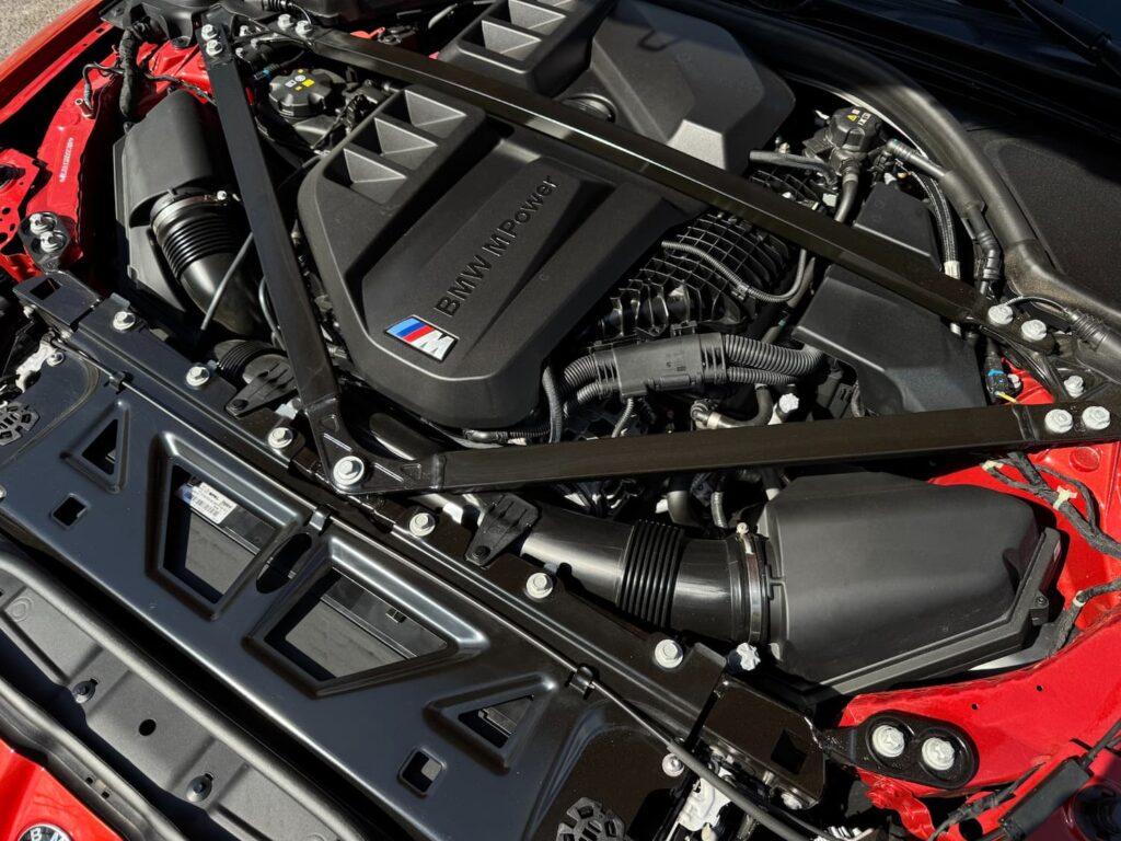 High-performance engine of the 2025 BMW M3, featuring a twin-turbocharged inline-6 design with advanced cooling and precision engineering.
