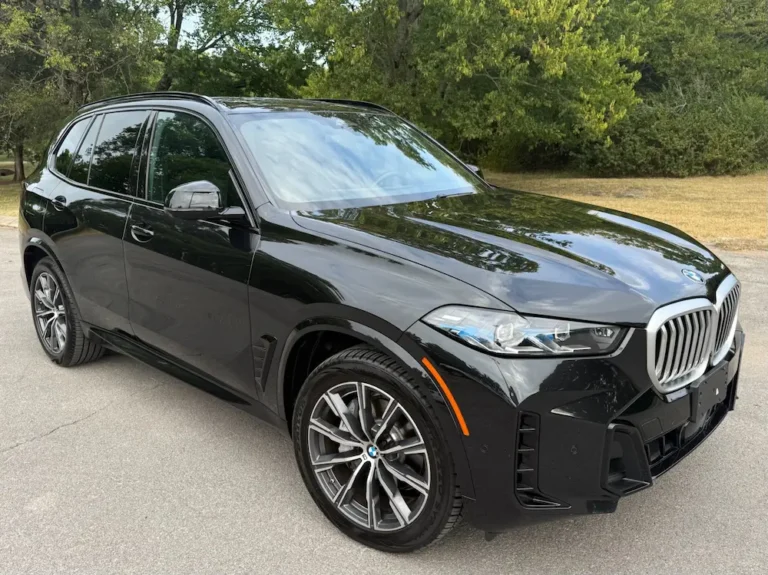 black BMW X5 midsize SUV with silver grille parked outdoors