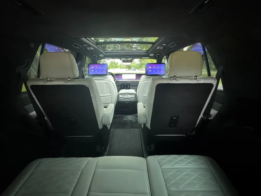 2025 Cadillac Escalade rear-seat entertainment and panoramic cabin view with premium leather seating.