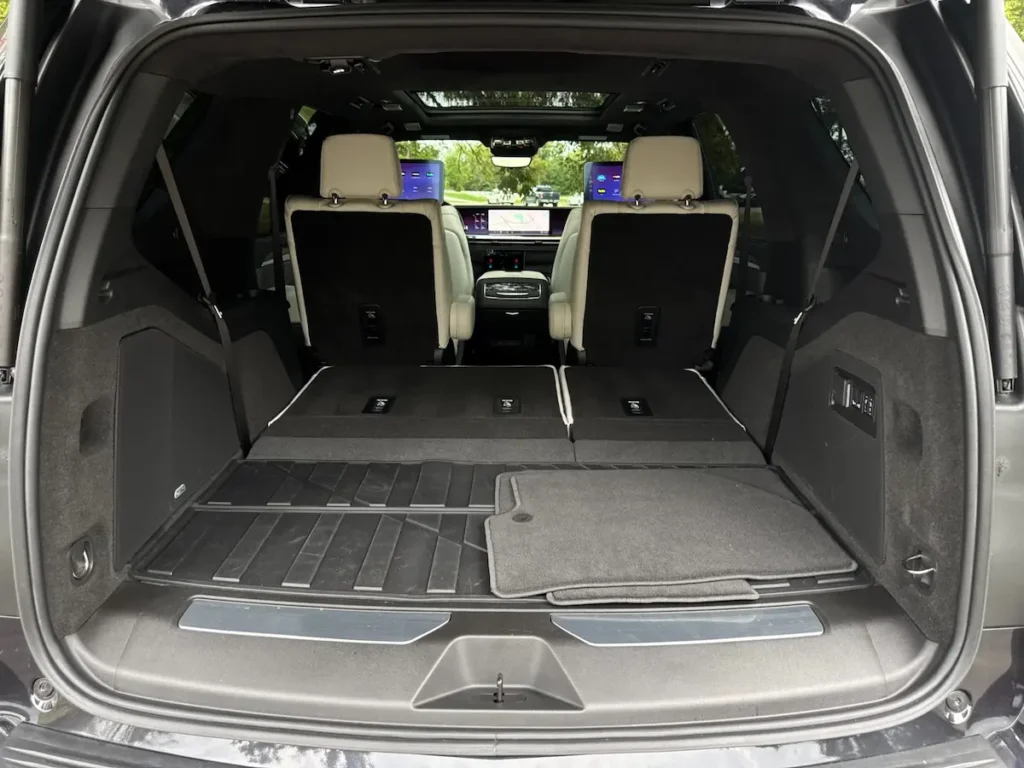 2025 Cadillac Escalade cargo area with third row folded flat for expanded storage space.