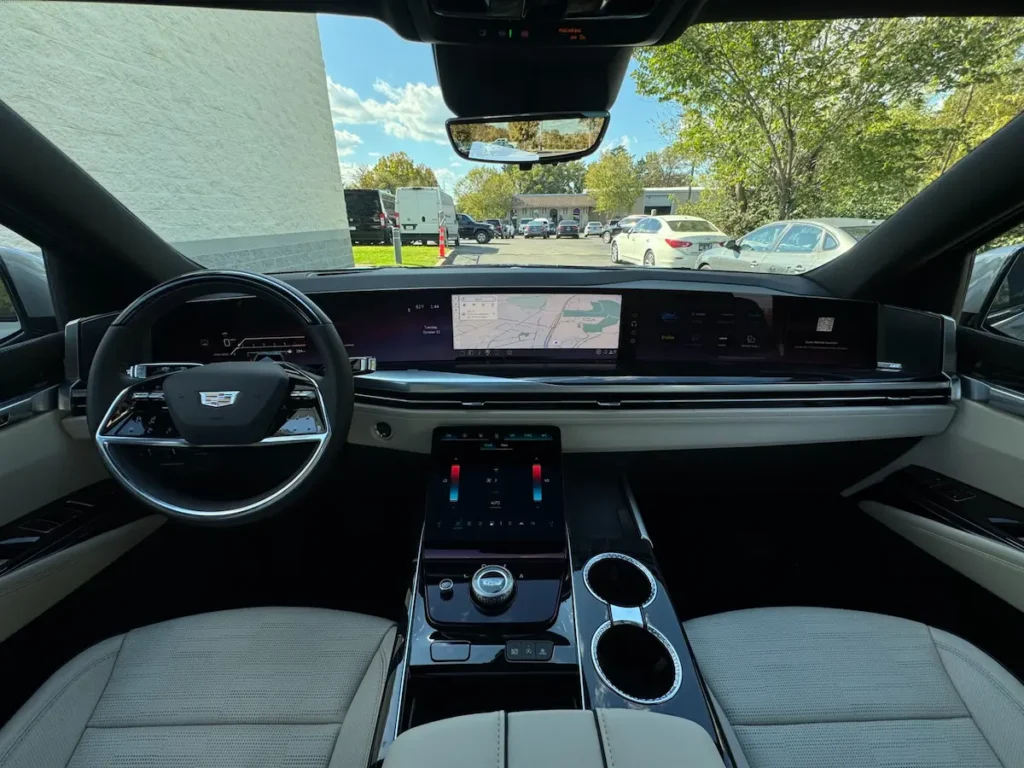 2025 Cadillac Escalade Sport interior dashboard with OLED curved display and premium materials.
