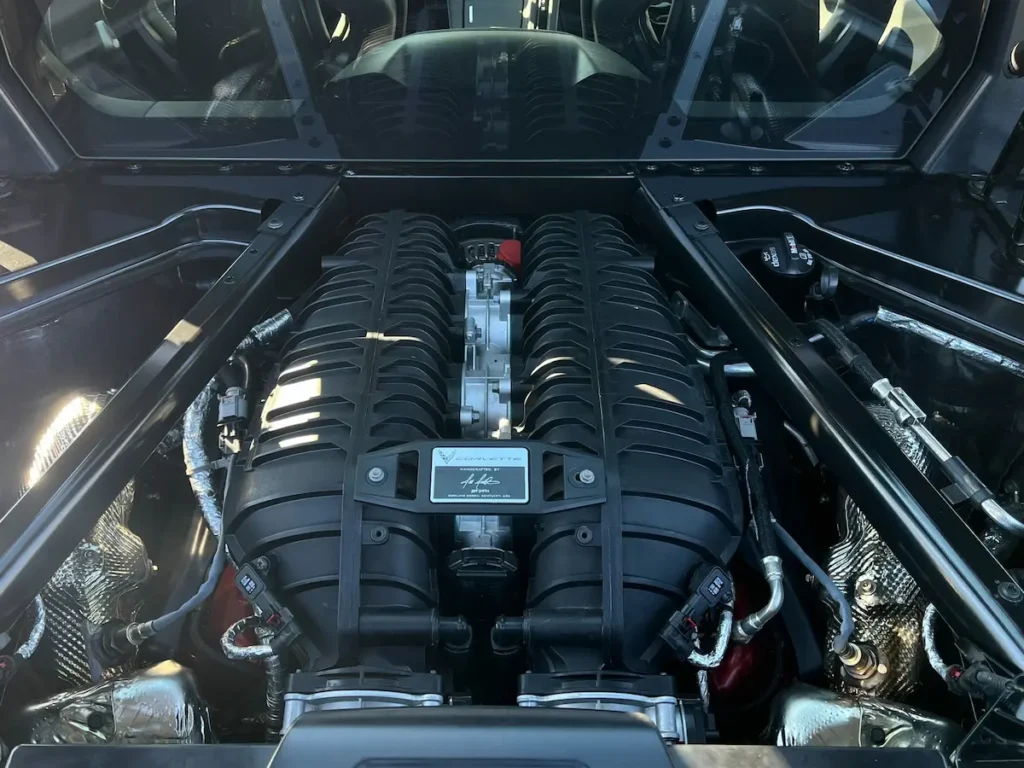 Chevrolet Corvette Z06 LT6 flat-plane V8 engine viewed through rear glass