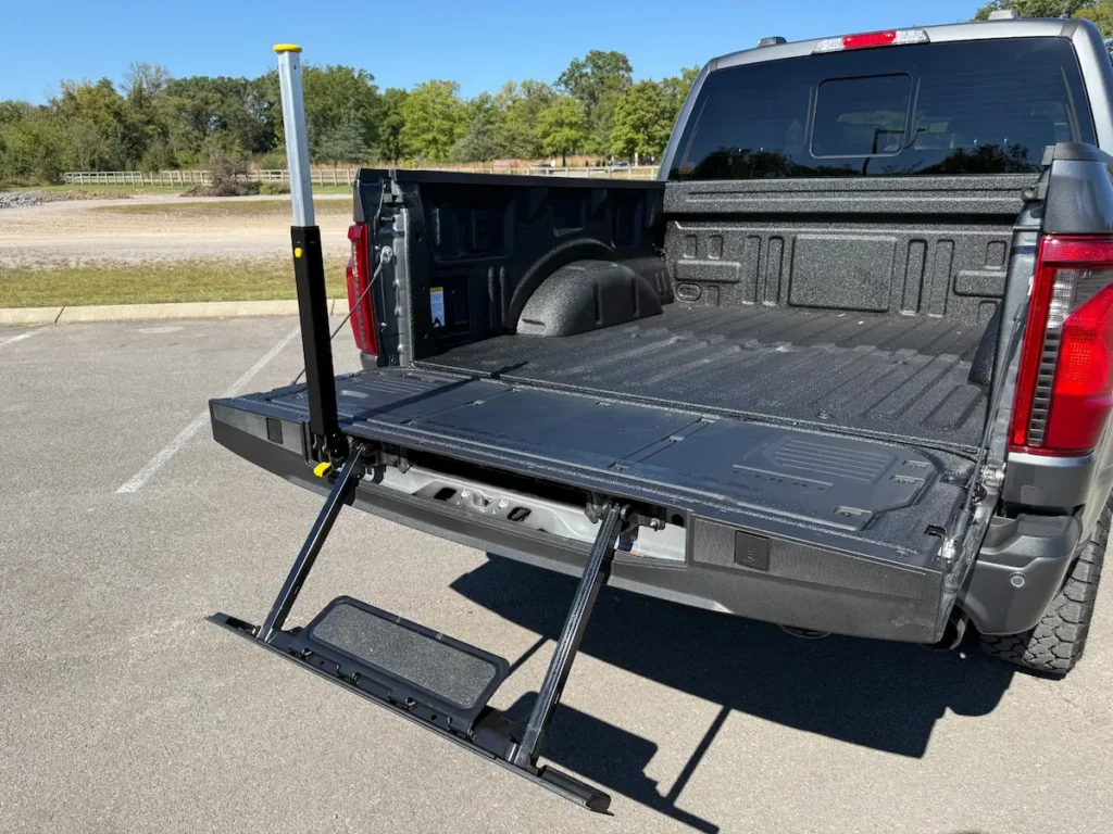 Ford F-150 tailgate step system extended for easy bed access.