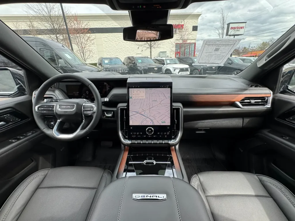 Front interior view of the 2025 GMC Yukon XL Denali featuring digital cockpit and infotainment system.