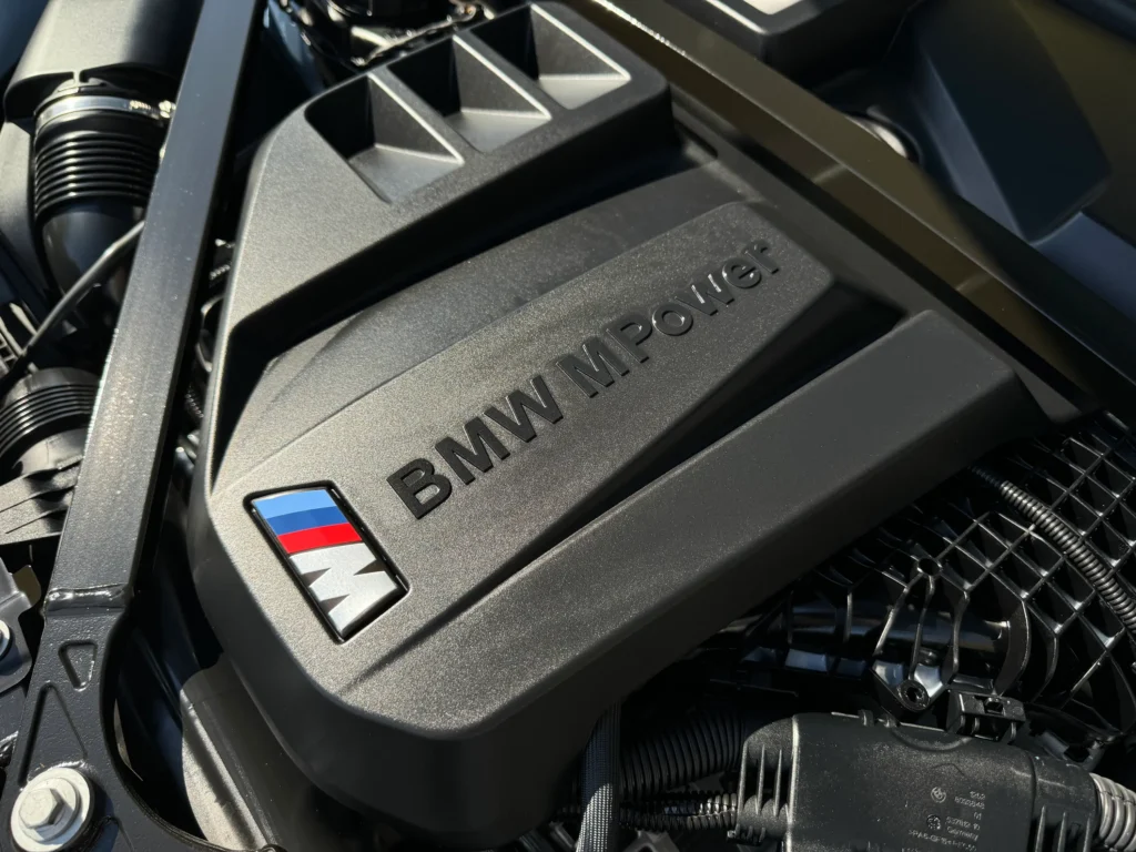 The engine of the 2023 BMW M2, showcasing a powerful inline-6 TwinPower Turbo under the hood.