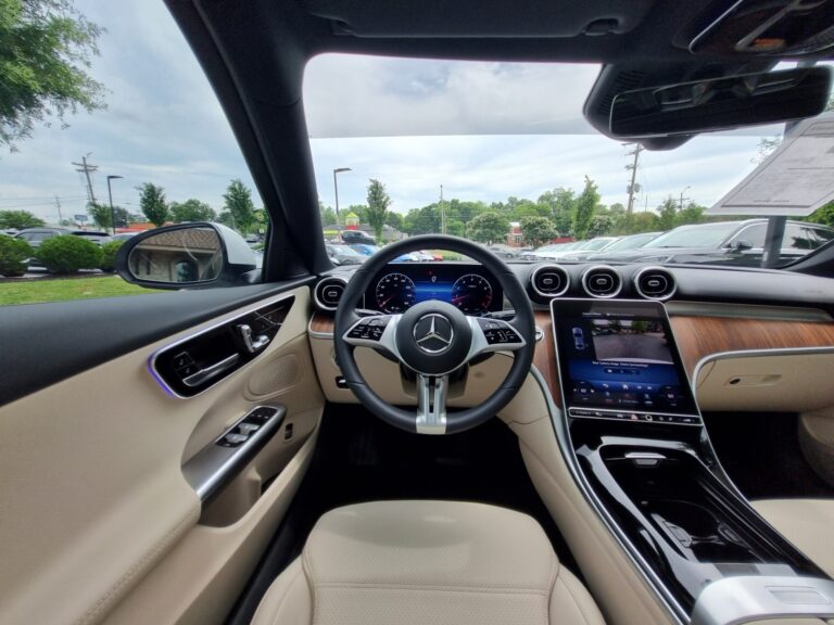 Interior of a used 2024 Mercedes-Benz C 300 4MATIC at AutoPro Nashville, showing the steering wheel, dashboard, and infotainment system.